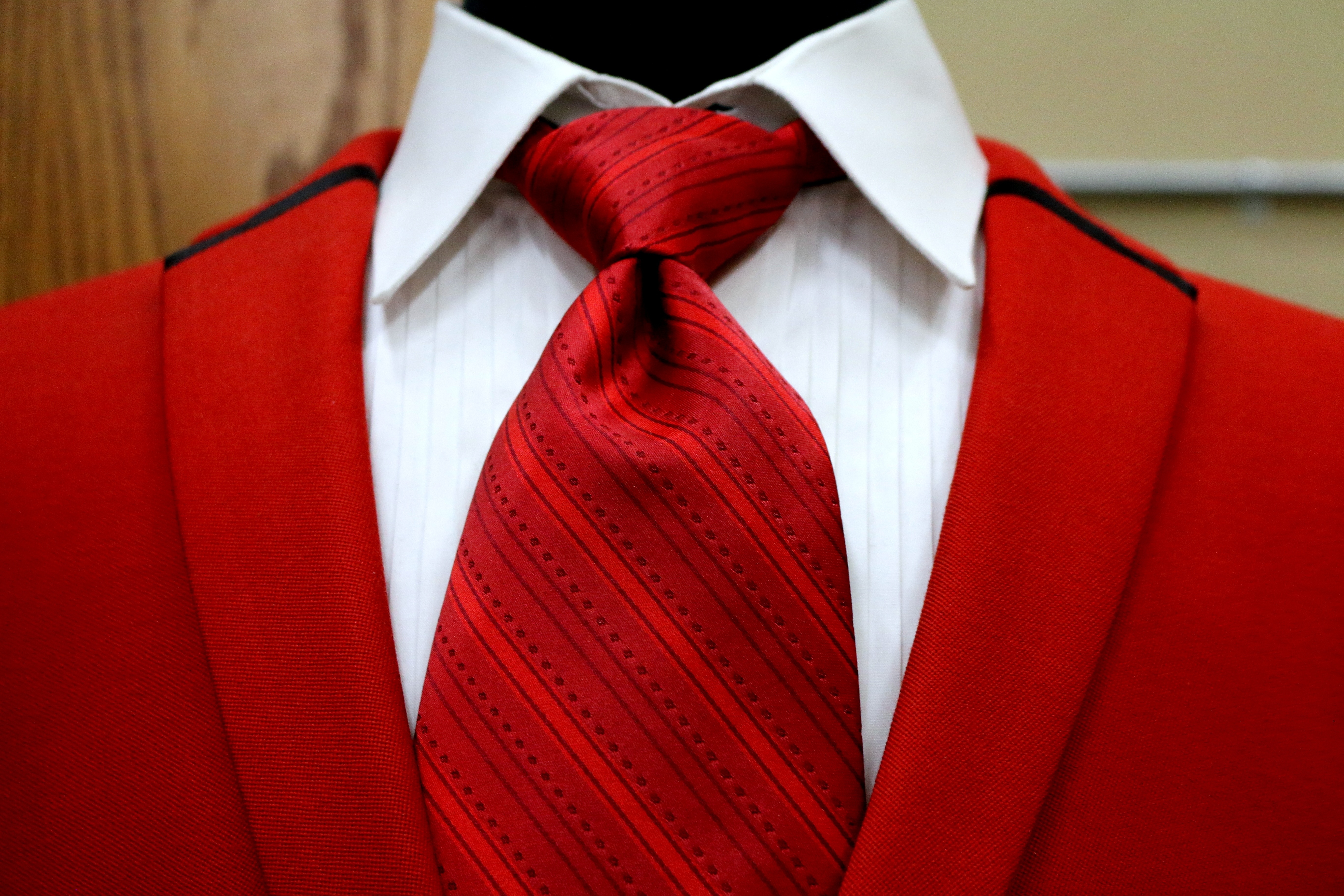red necktie and blazer