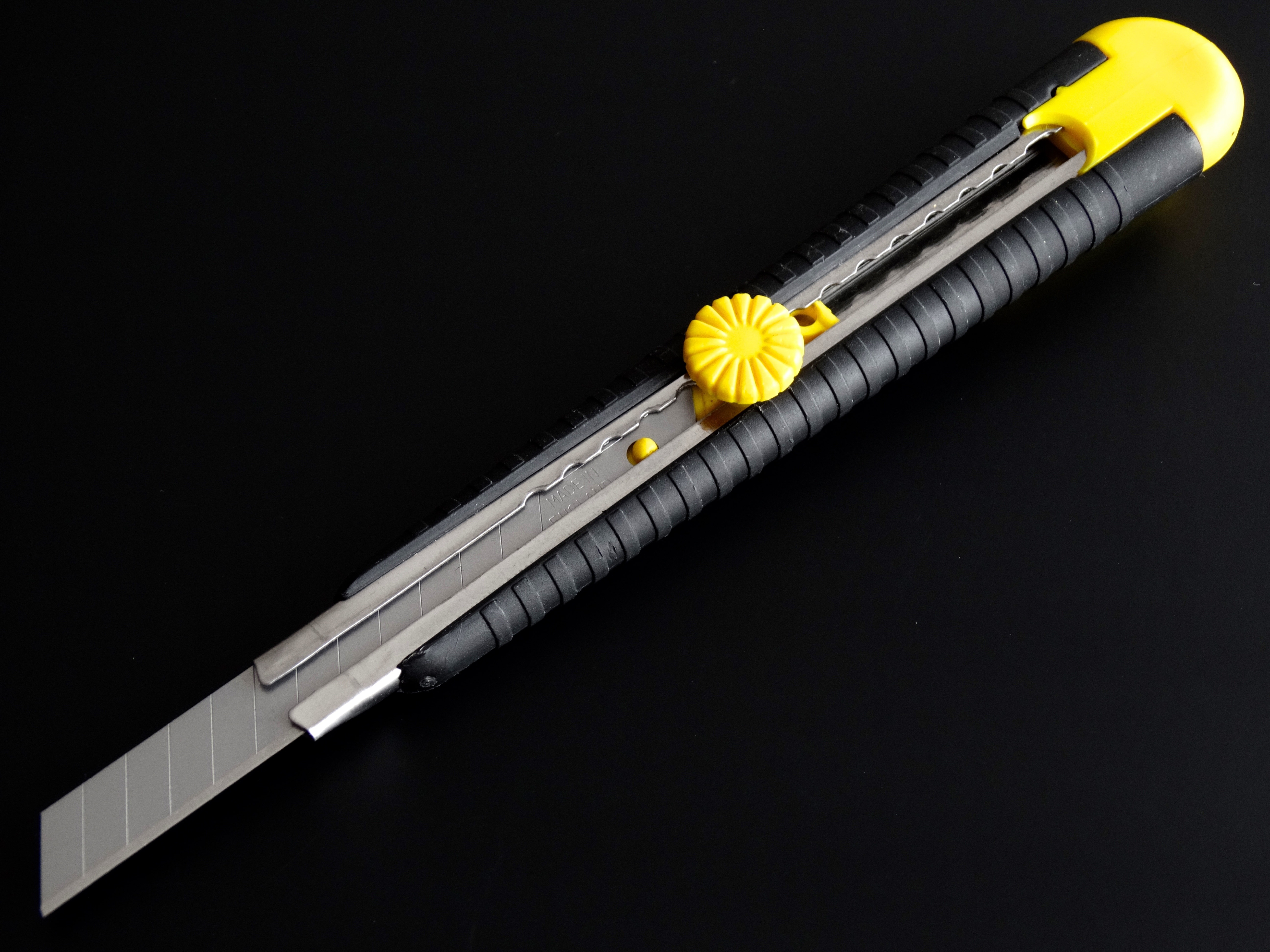 black and yellow cutter blade