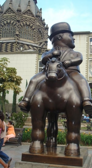 man riding on horse brown statuette thumbnail