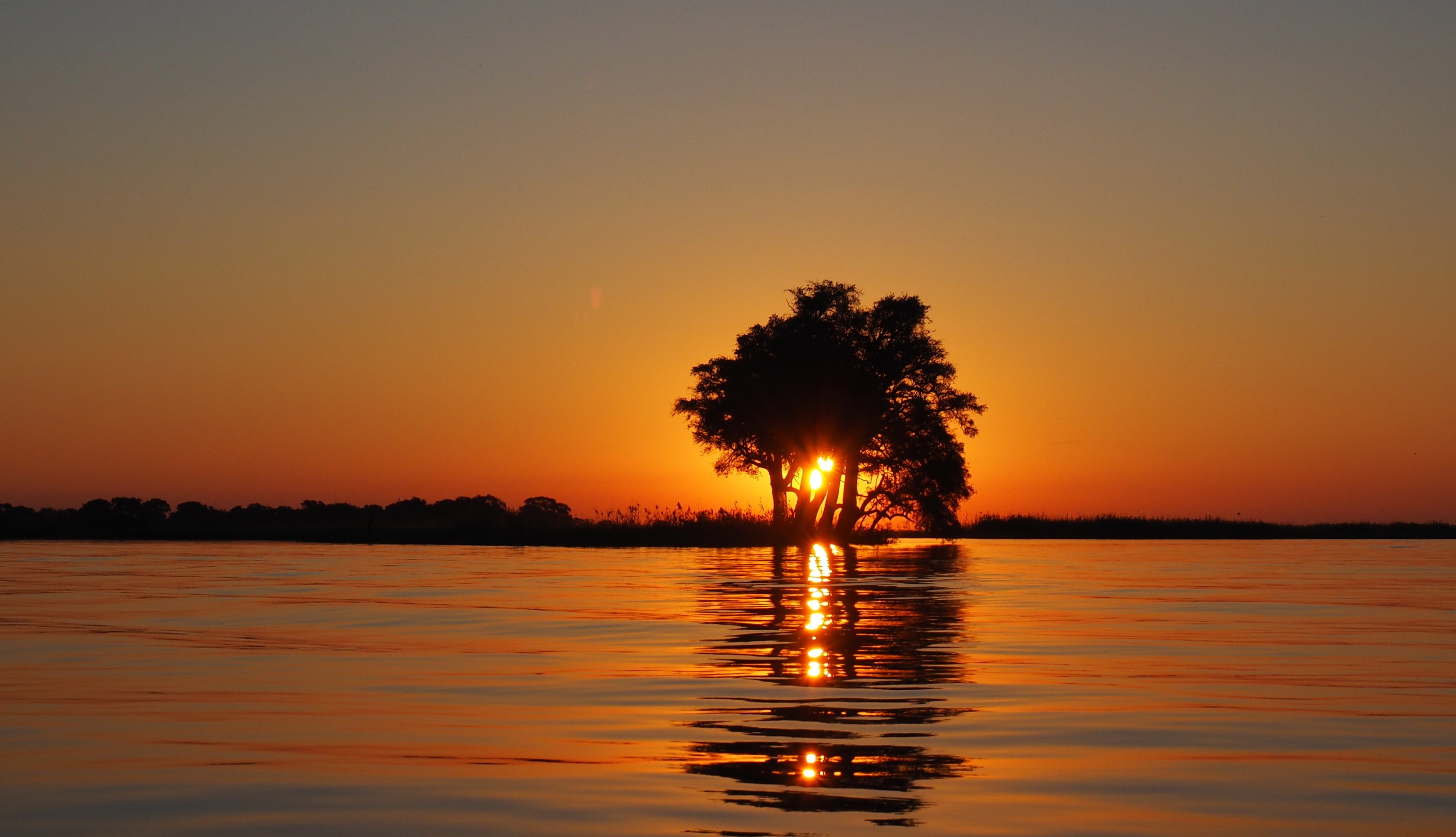 body of water during sunset