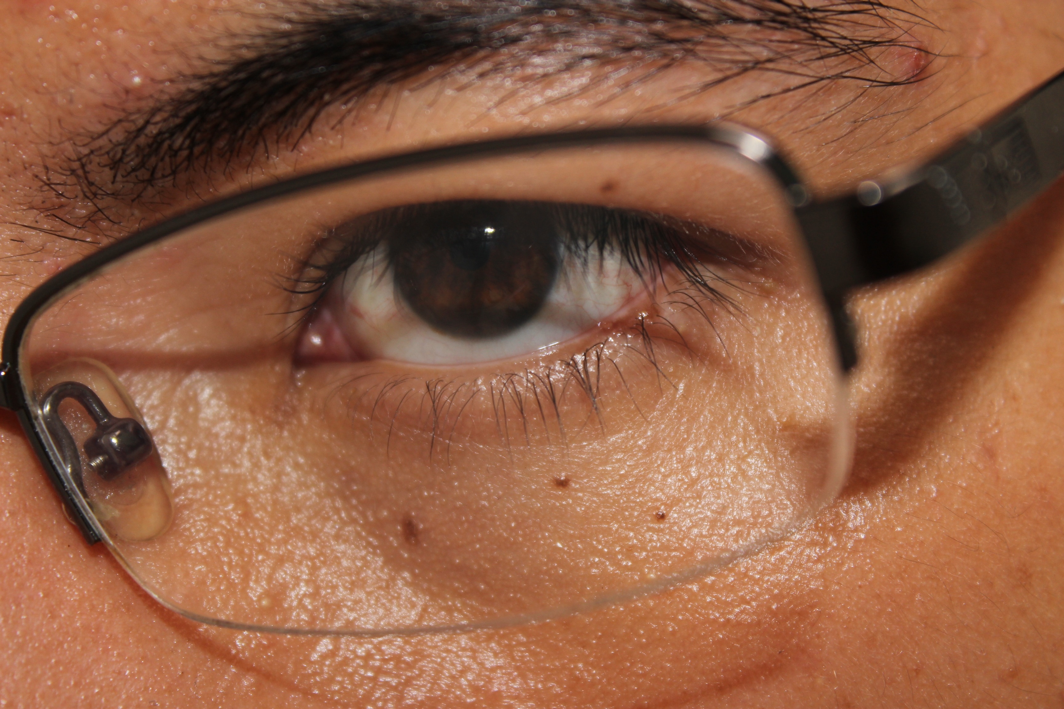 close up photo of man in black framed eyeglasses
