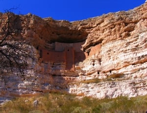 brown rock formation with blue sky thumbnail
