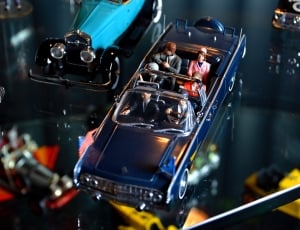 blue convertible sedan with people toy thumbnail