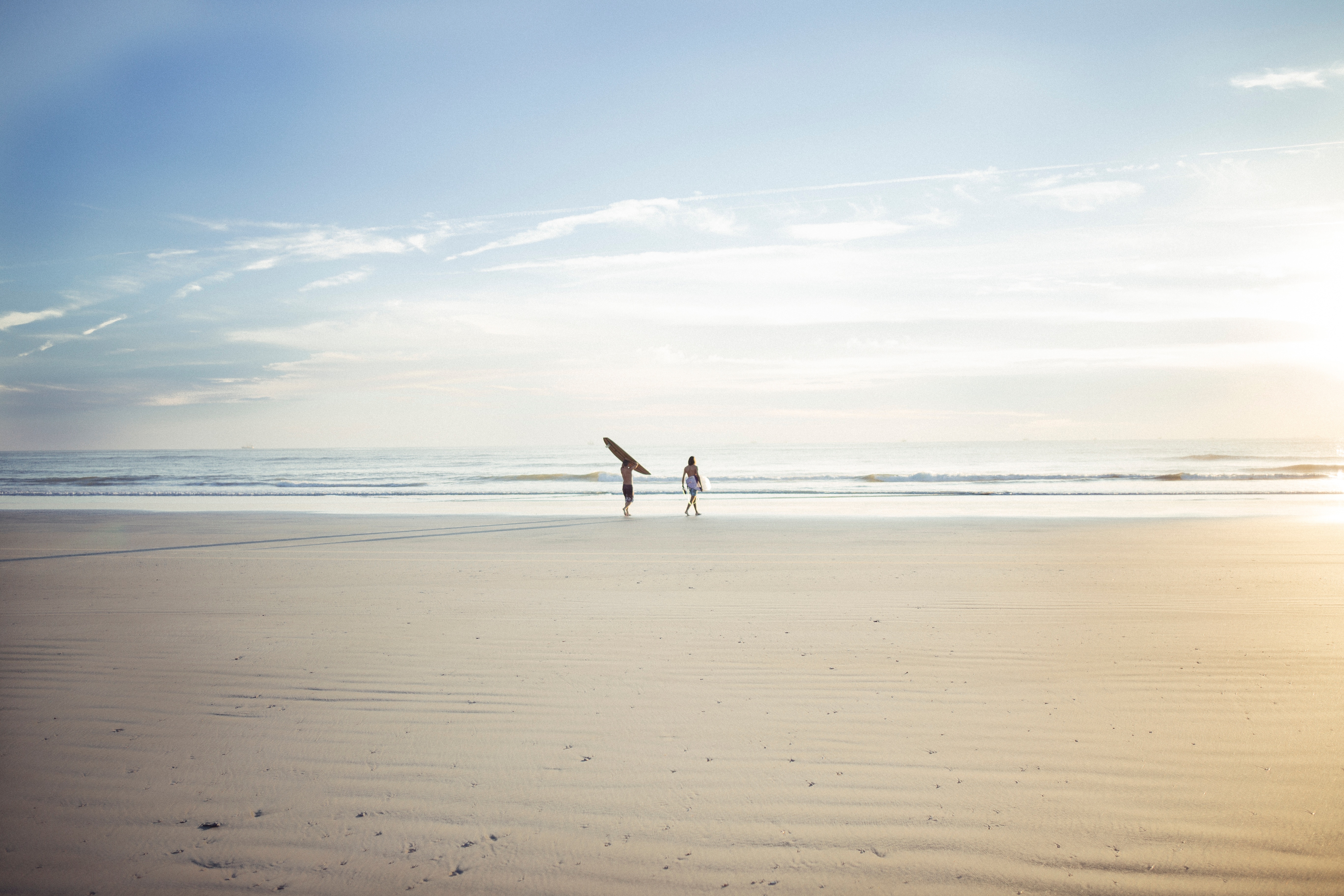 two people on grey sand