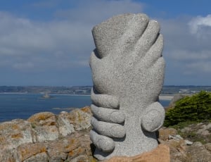 hands stone sculpture thumbnail