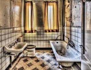 bathroom ceramic bathtub, sink and toilet bowl thumbnail