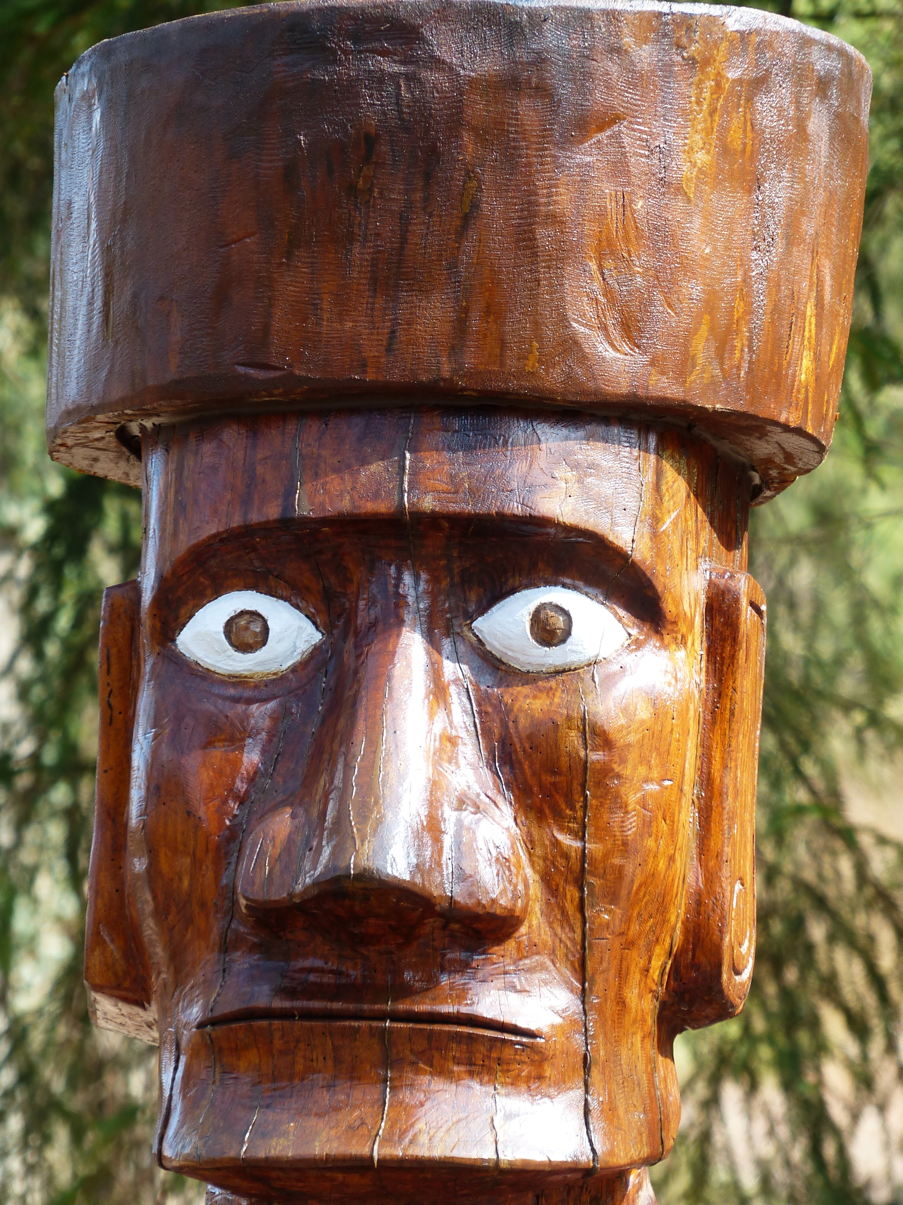 brown wooden tribal man face sculpture
