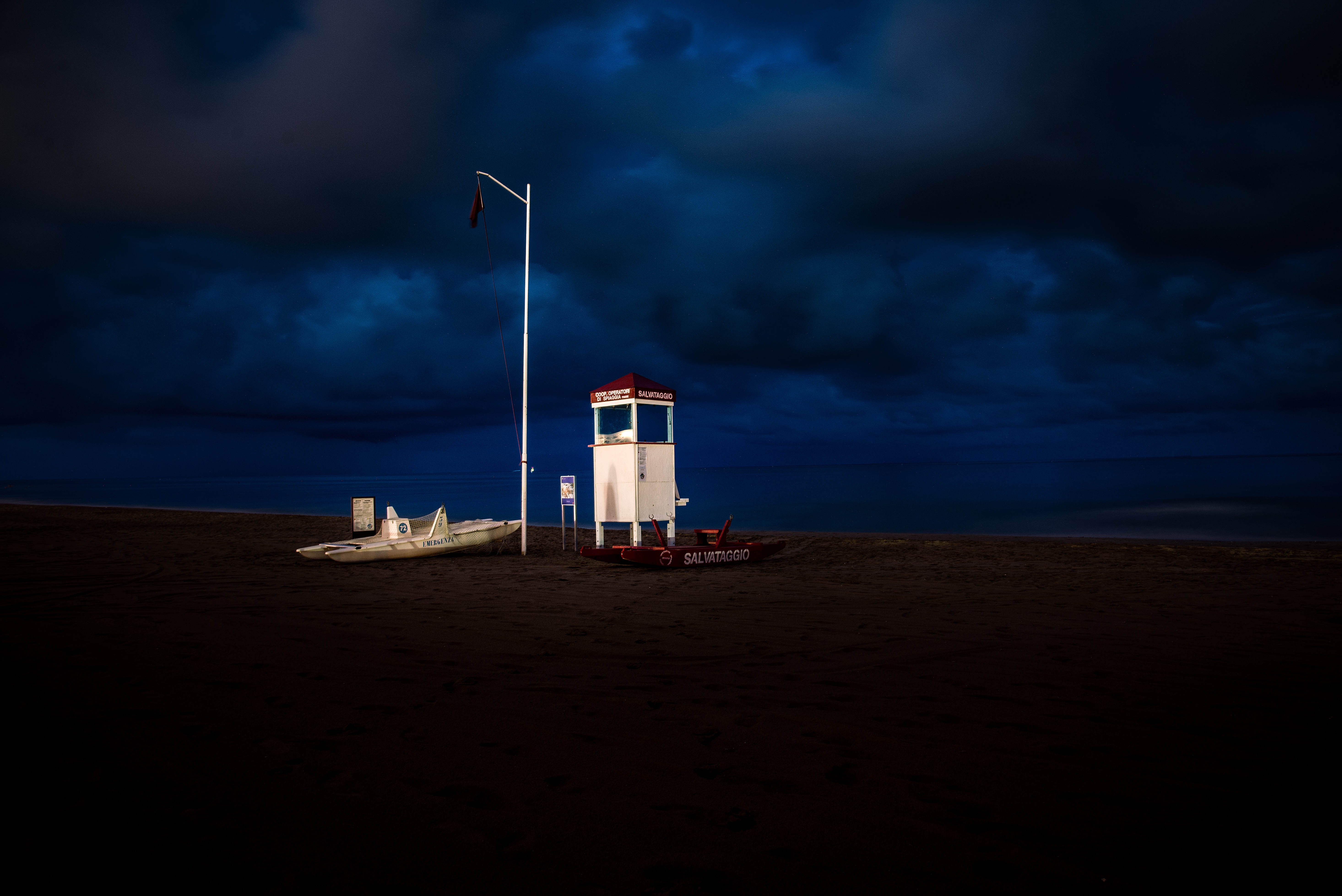 white wooden life guard post