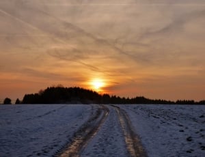 snow covered field during sunset ] thumbnail