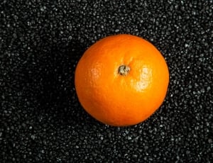 orange on black table during daytime thumbnail