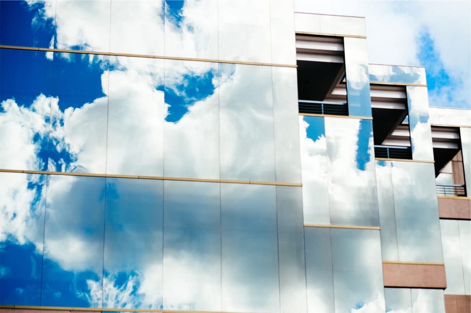 mirrored building blue clouds preview