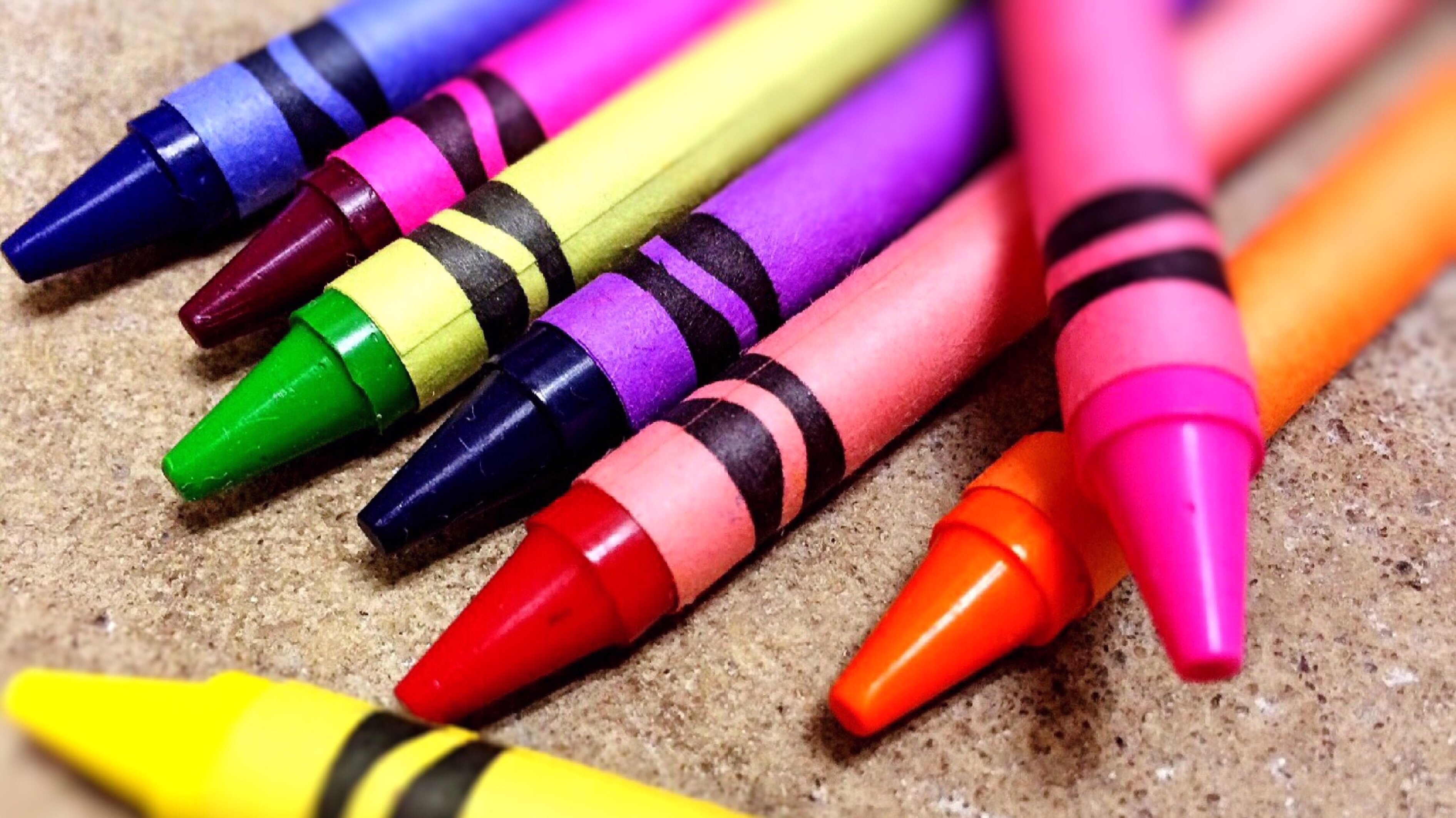 assorted crayons on brown top