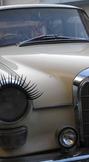 close up photo of beige metallic car thumbnail