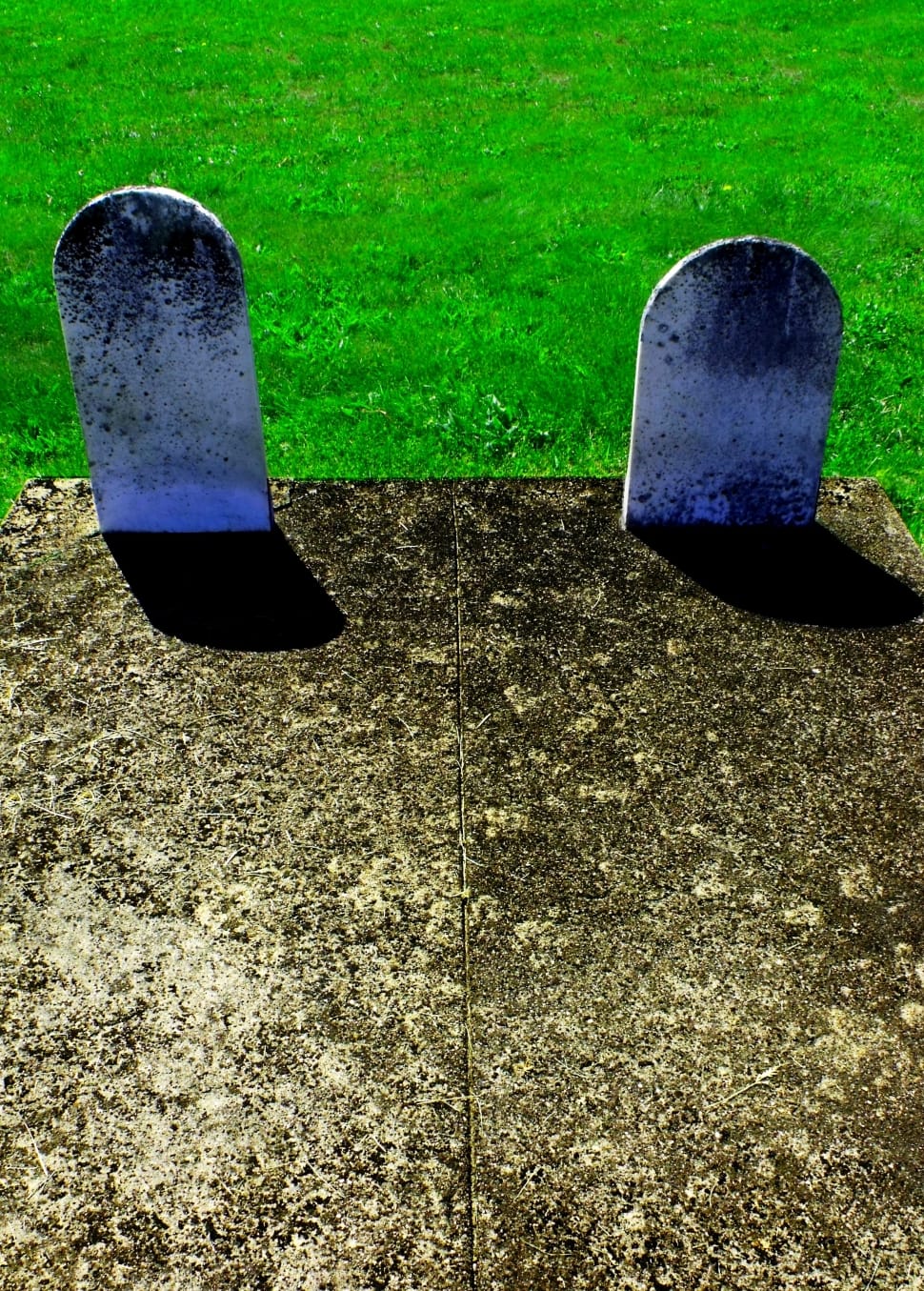 two tombstones near grass preview
