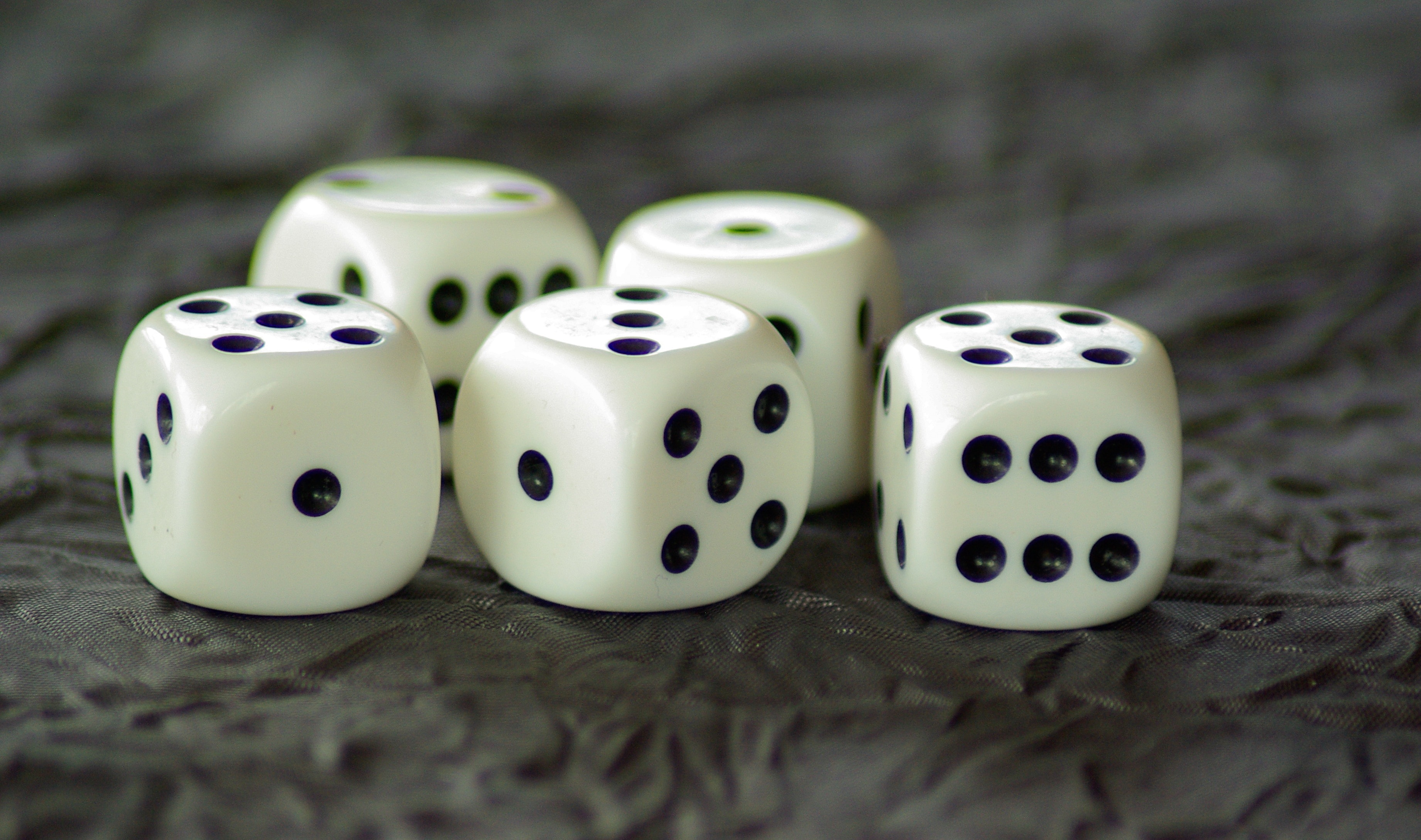 four white and black dice