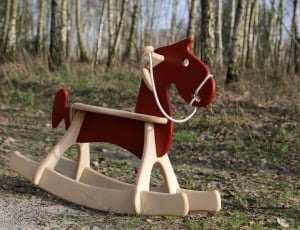 toddler's red and white rocking horse thumbnail