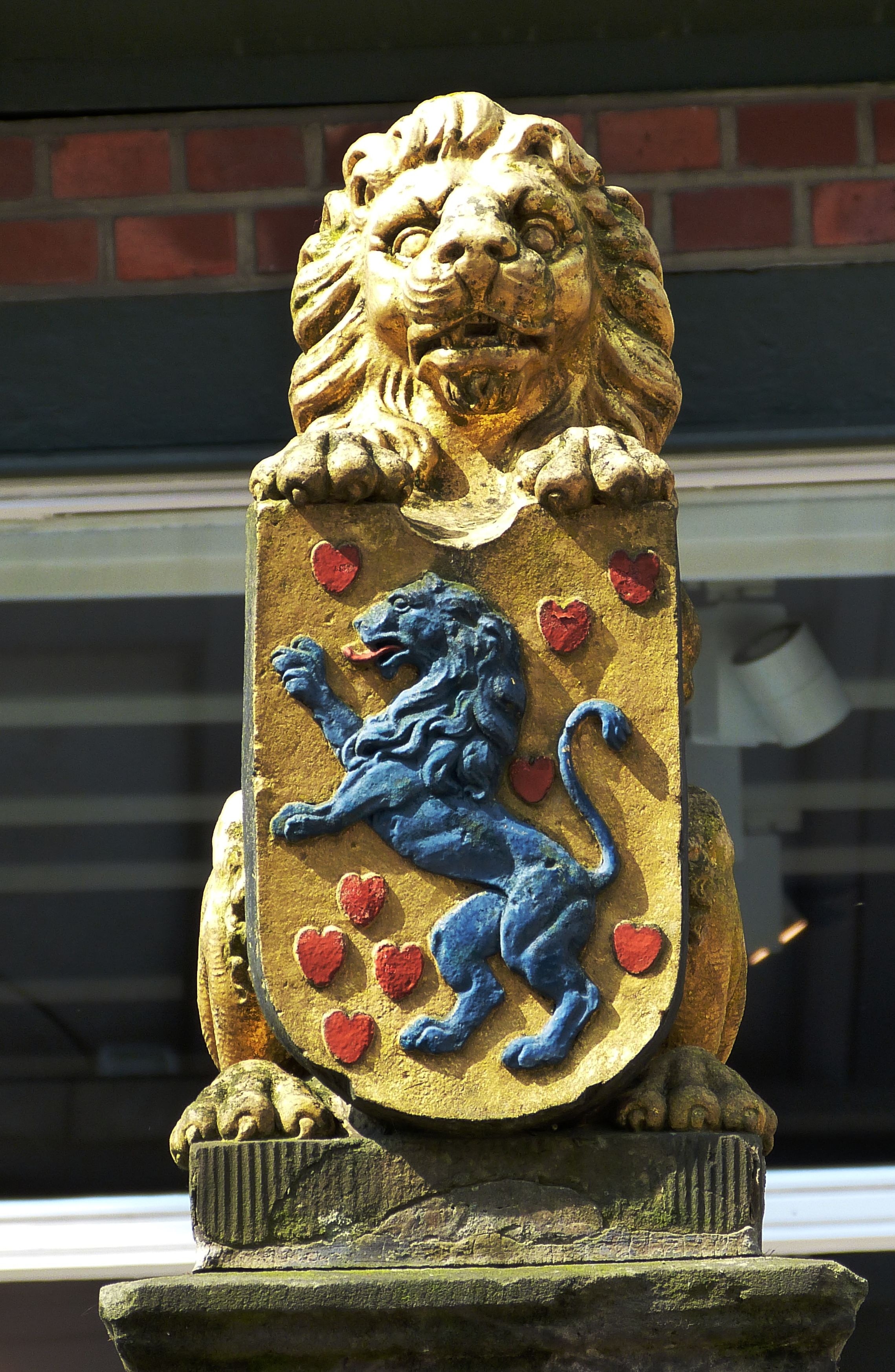 lion embossed shield lion statuette