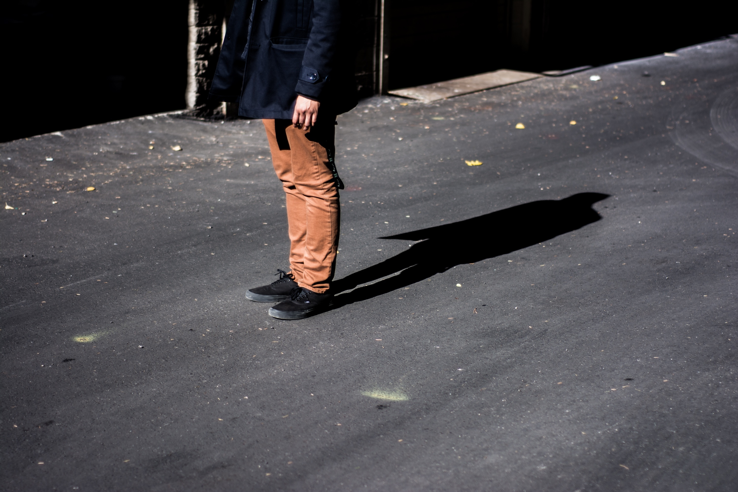 close up photo of person with brown pants and black shoes