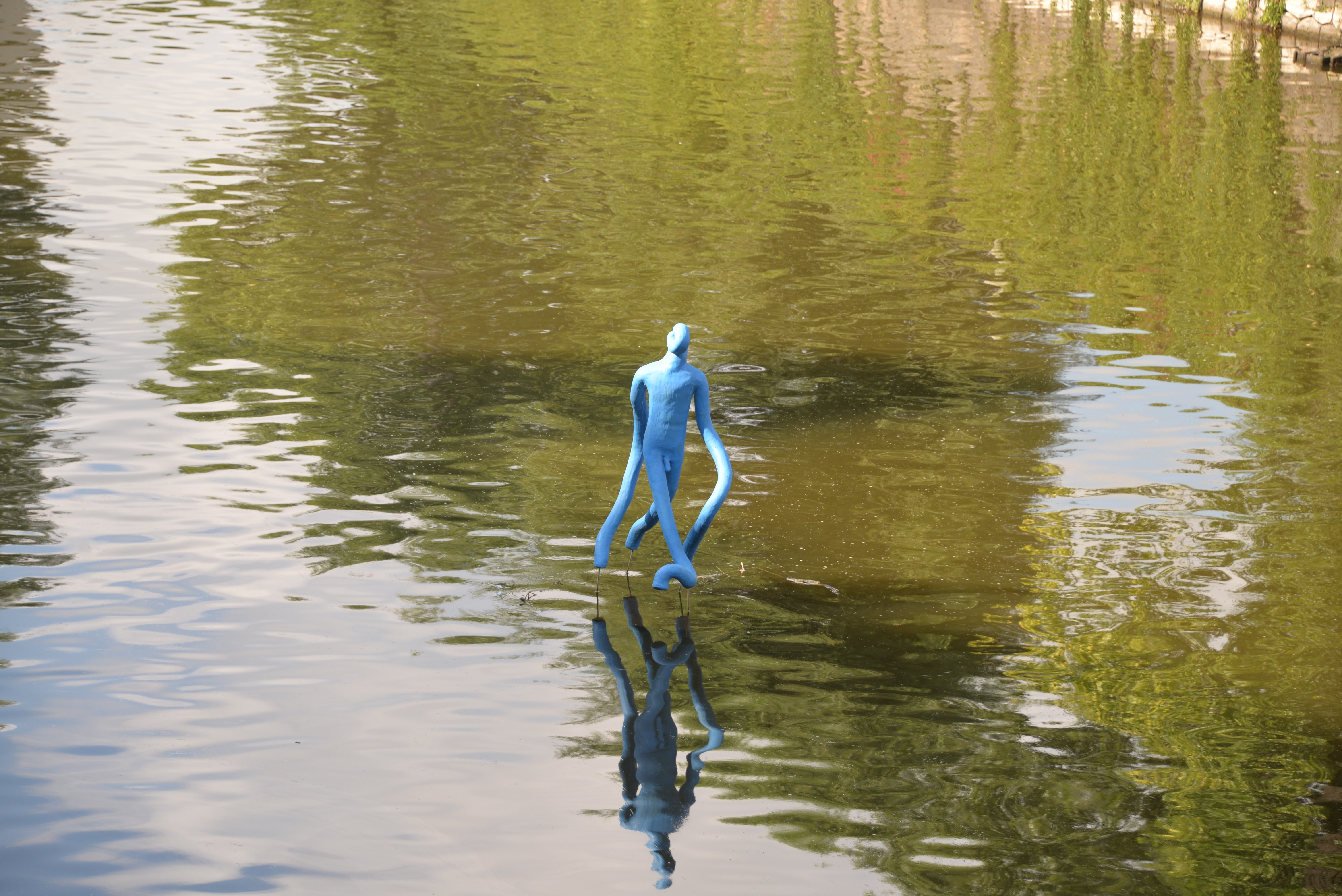 blue floating statuette