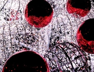 closeup photo of black, red ,and white ball decors thumbnail