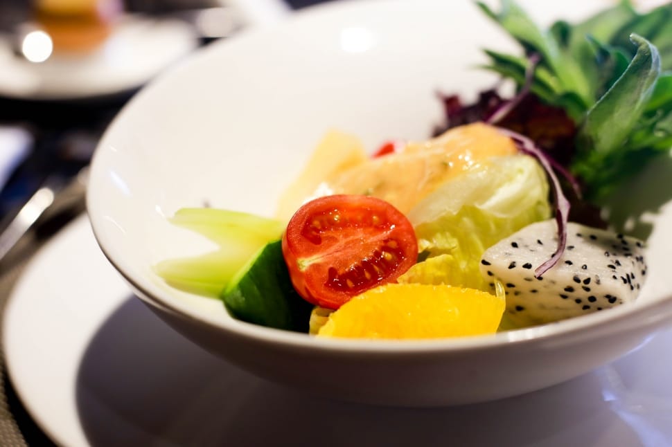 sliced vegetables on white ceramic bowl preview