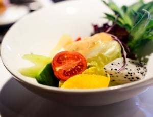 sliced vegetables on white ceramic bowl thumbnail