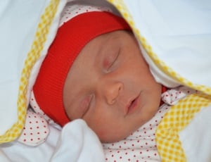 baby's red and white cap thumbnail