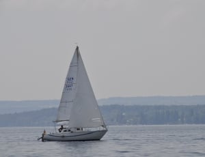 white and blue boat thumbnail