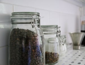 brown coffee beans in canister jar thumbnail