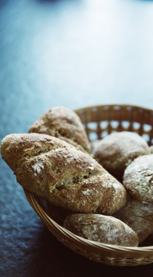 oval breads on brown wicker basket thumbnail