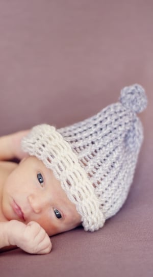 baby's gray and white knit cap thumbnail