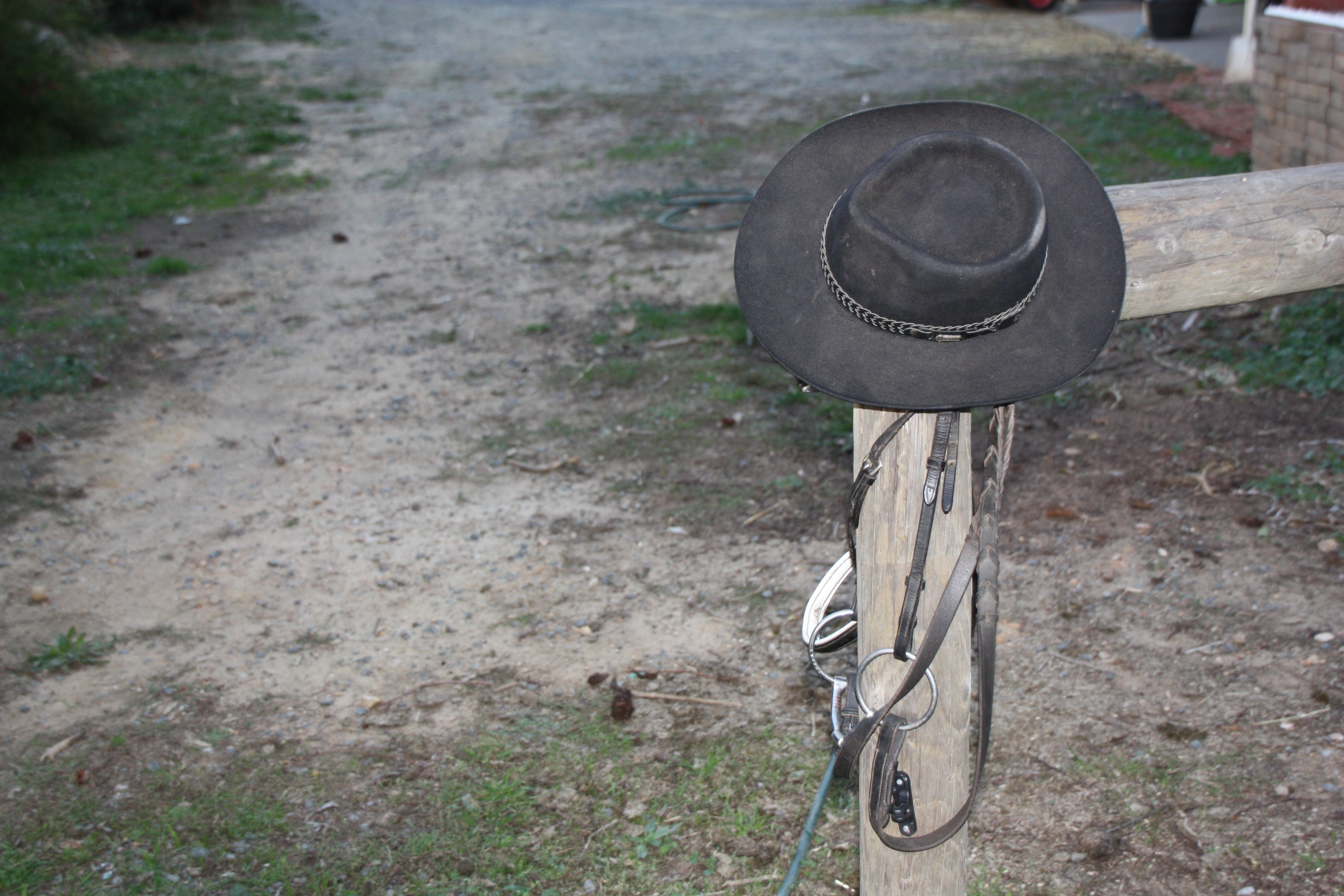 black cowboy hat on brown wood
