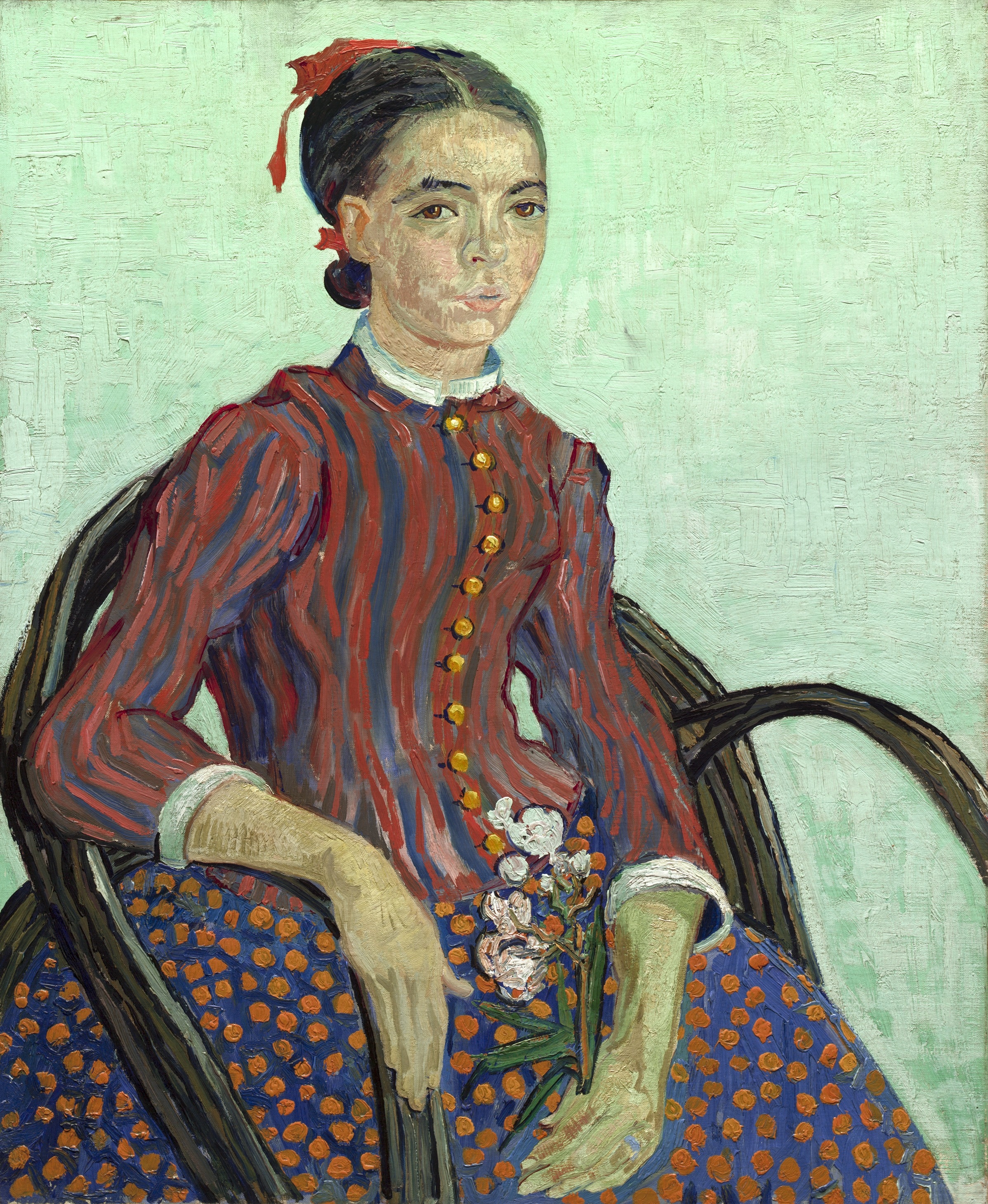 woman in long sleeve dress sitting on the chair painting