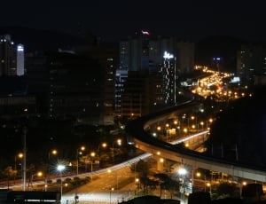 high rise building and street light near road thumbnail