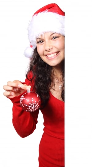 woman holding red Christmas bauble thumbnail