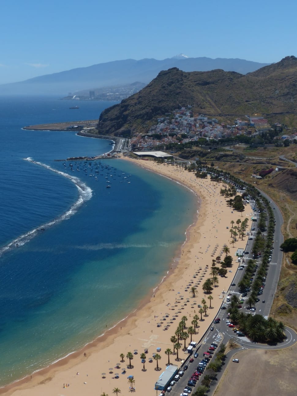 green grass covered mountain and ocean preview