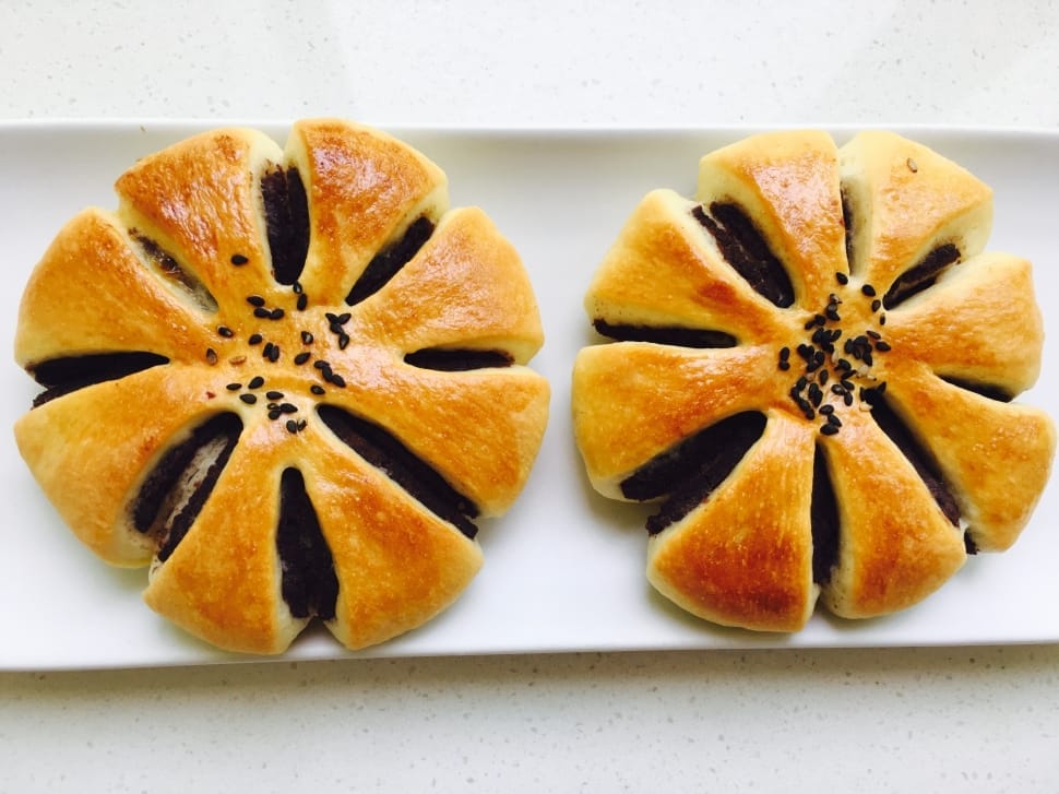 2 baked round pastries preview