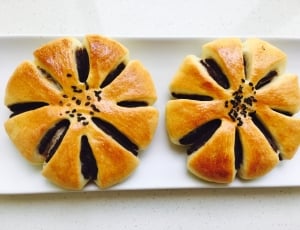 2 baked round pastries thumbnail