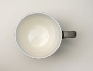 white and black ceramic mug thumbnail