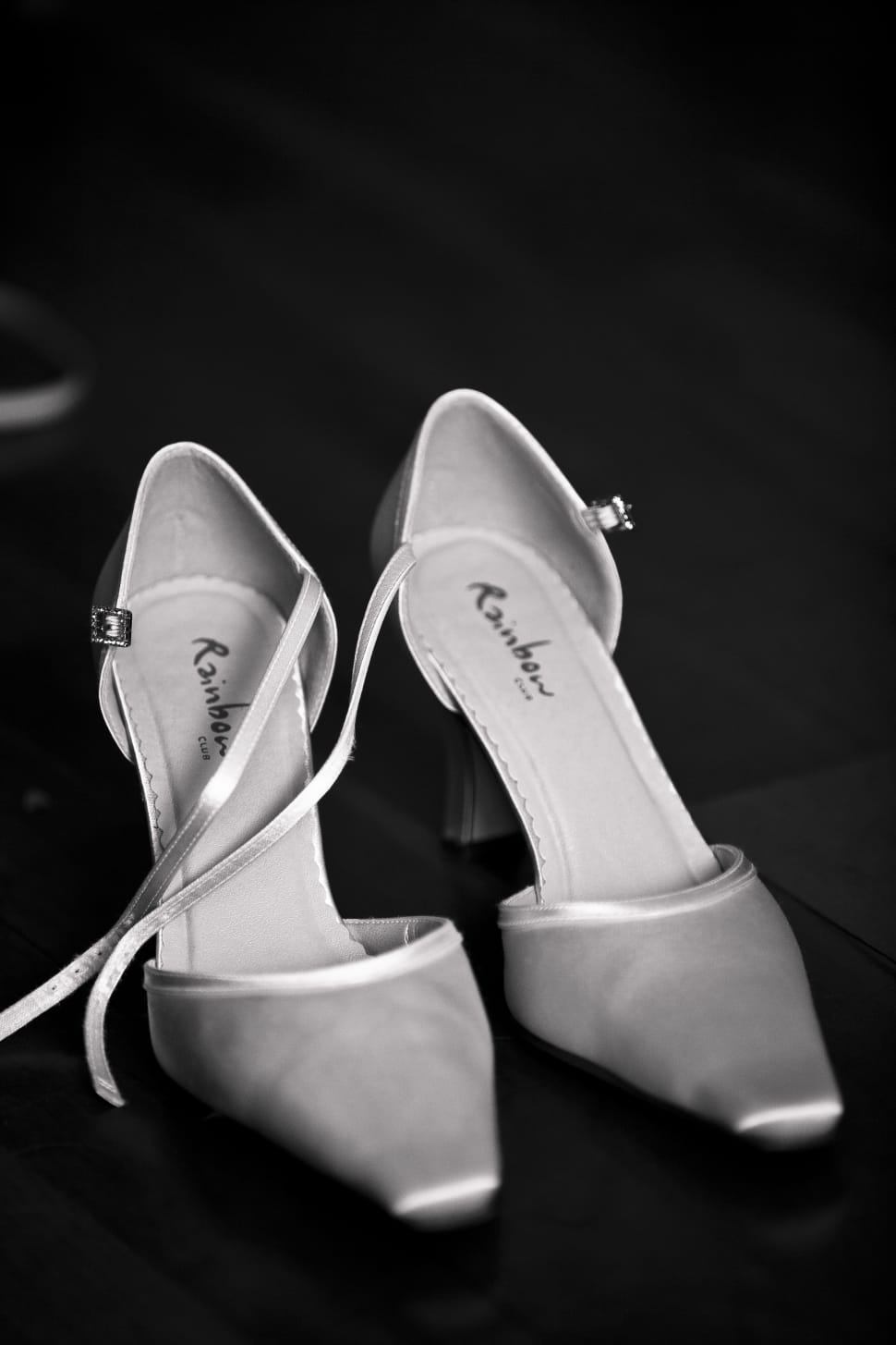 pair of white pointed toe ankle strap pumps preview