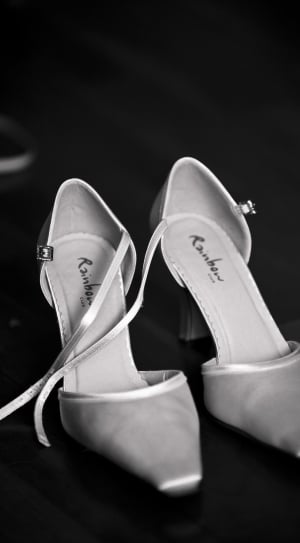 pair of white pointed toe ankle strap pumps thumbnail