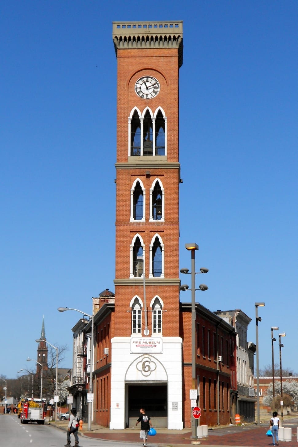 landscape photo of brown and white concrete clock tower preview