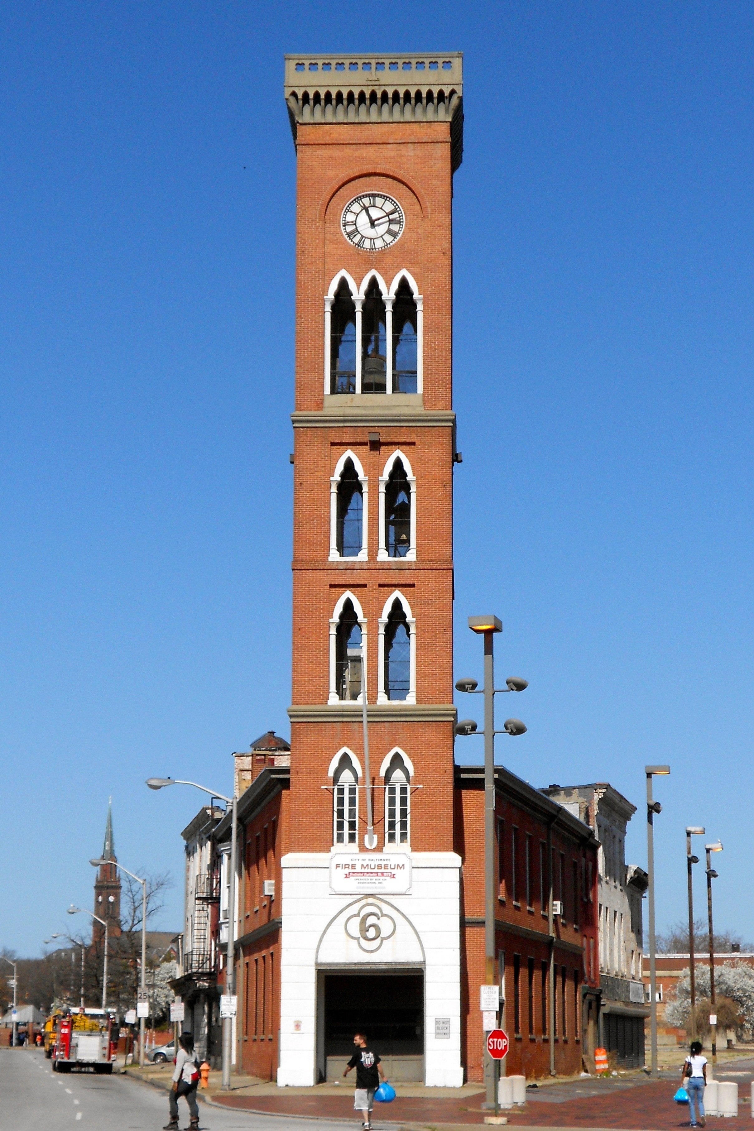 landscape photo of brown and white concrete clock tower