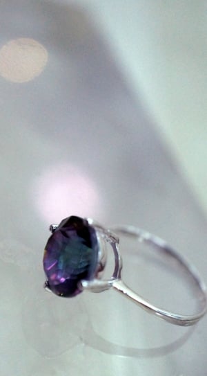 silver and blue gemstone ring on white surface thumbnail