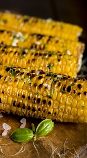 grilled corn on the cob with basil on top thumbnail