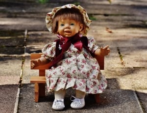 pink and white floral dressed doll thumbnail
