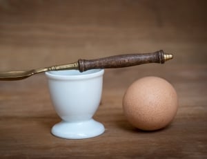 brown wooden handle spoon with ceramic cup thumbnail