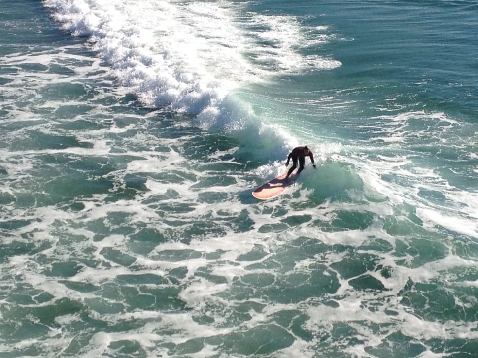 man surfing during daytime preview