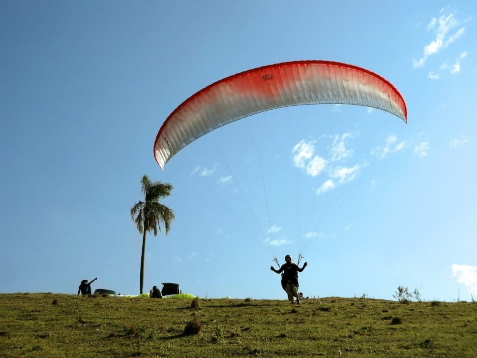 red and white paragliding preview