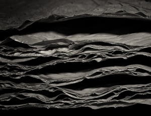 greyscale photo of pile of sheets thumbnail